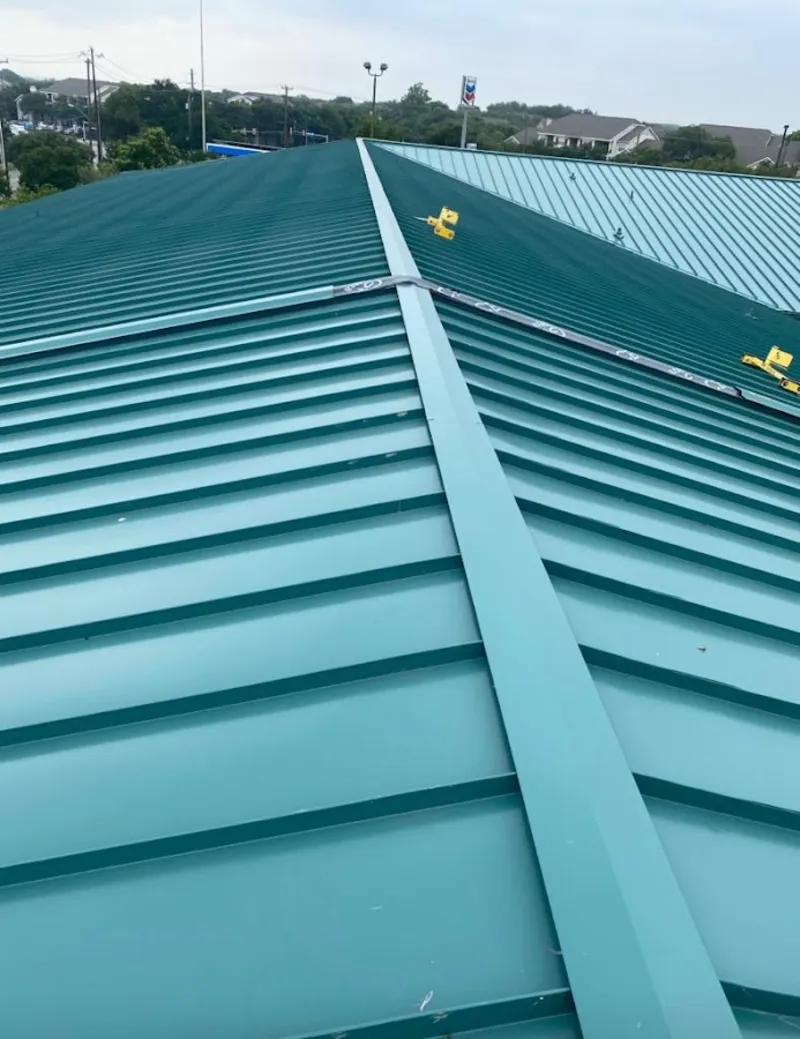 Green commercial metal roof ridge and valley for Metal Roof Repair in Jaffrey